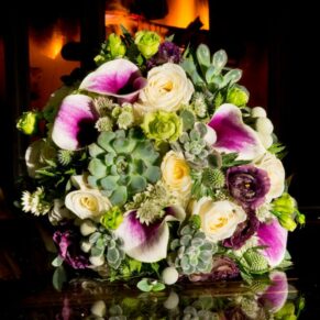 Buckinghamshire detail wedding photography of the bride's bouquet captured beside the log fire