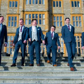 The lads take a stroll at Eynsham Hall Christmas wedding