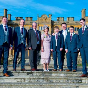 The groom and his family at Eynsham Hall Christmas wedding