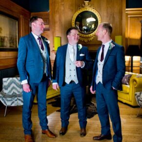 The lads chatting in the Gun Room at Eynsham Hall Christmas wedding