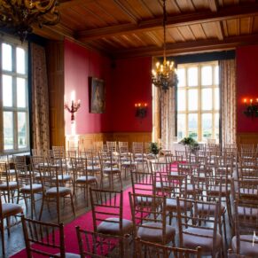 The Red Room ready for the ceremony at Eynsham Hall Christmas wedding