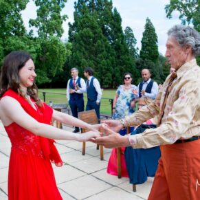 Guests dance on the terrace at Taplow House Hotel wedding
