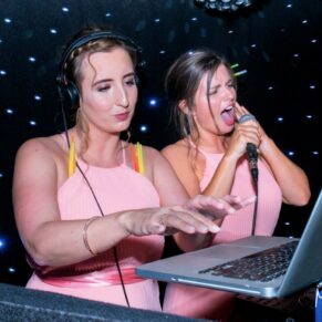 Hartwell House wedding photographs of the bridesmaids spinning the tracks
