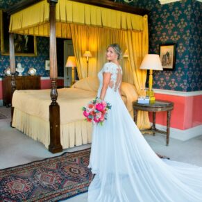 Hartwell House wedding photographs of the four poster bedroom with the bride