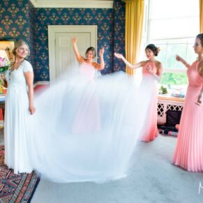 Hartwell House wedding photographs of the gown being arranged