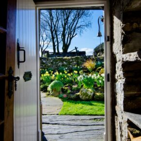 UK Holiday homes photography - through the rustic doorway in the Yorkshire Dales