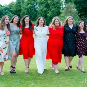The bride takes a stroll with some girlfriends at her Missenden Abbey wedding