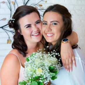 A hug for the bride at her Missenden Abbey wedding