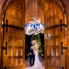 Waddesdon Dairy winter wedding photography through the grand entrance doorway