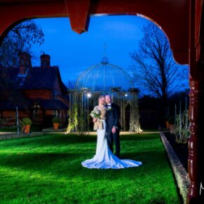 Waddesdon Dairy winter wedding photography through the archways of the Buttery