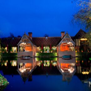 Waddesdon Dairy winter wedding photography over the lake at dusk