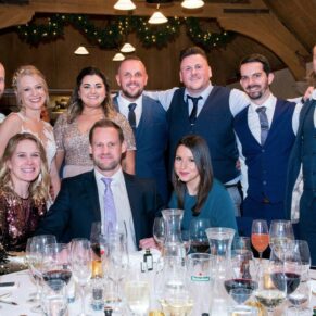 Waddesdon Dairy winter wedding photography of a table group pose in the West Hall