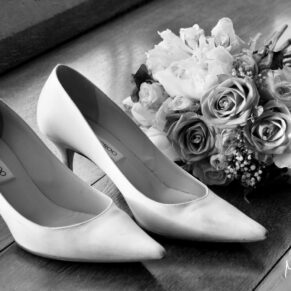 Buckinghamshire black and white wedding photography of the bride's shoes