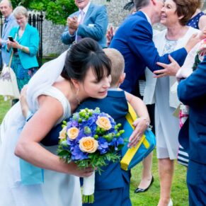 A big hug for the bride at her St Mary's Chesham Church wedding