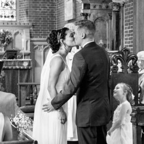 First kiss at St James Church Fulmer wedding
