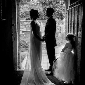 Wedding silhouette pose in the doorway at St James Church Fulmer