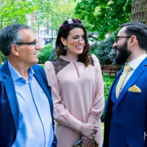 Marylebone wedding photography - wedding guests enjoy the banter in the gardens at the Dorset Square Hotel
