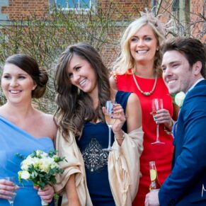 Some of the guests enjoy the sunshine at Dorton House wedding