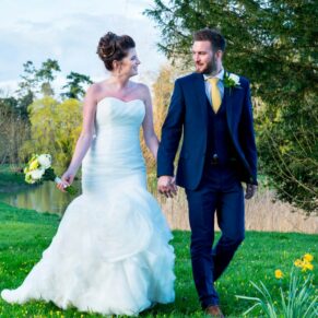 The newlyweds take a stroll at their Dorton House wedding