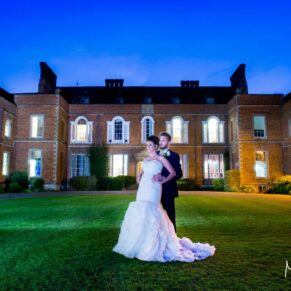 Floodlit pose of the newlyweds at Dorton House wedding