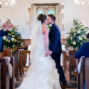 The first kiss at Dorton House wedding ceremony in the chapel
