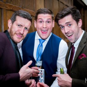 Three lads pose for the camera at Dorton House wedding