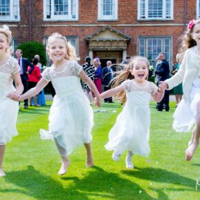 Photos at Dorton House wedding of the young girls running