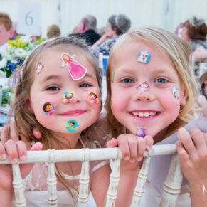 Photos at Dorton House wedding of the flower girls up to their antics