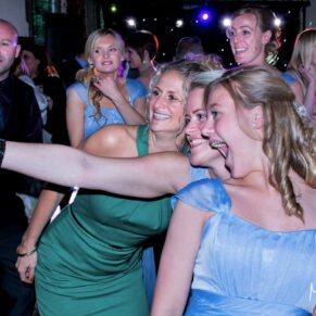 Selfie shot of three fun loving ladies on the dance floor during the evening wedding reception at Dorton House