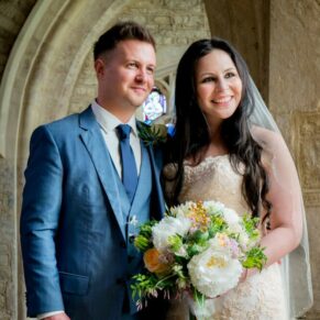 Window portrait of the newlyweds at St Giles Church wedding - Standlake