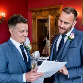 Eynsham Hall candid wedding photographs in the Red Room