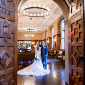 Eynsham Hall wedding photographs through the Great Hall doorway