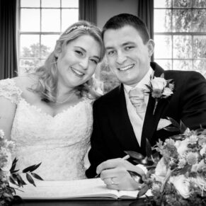 Signing of the register at Haddenham Baptist Church wedding