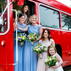 Hampden House wedding pose beside the London red bus