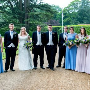 The bridal party stroll along the driveway at Hampden House wedding