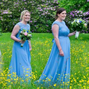 Walking through the flower meadow at Hampden House wedding