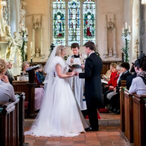The ceremony in progress at St Mary Magdalene Church - Hampden House Christmas wedding
