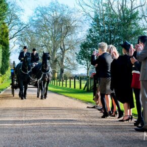 The guests greet the bride and groom at Hampden House Christmas wedding