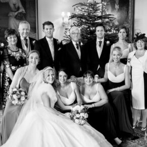 Family group shot inside Hampden House at Christmas wedding