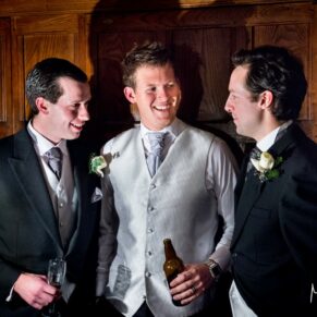 The guys enjoying the banter at Hampden House Christmas wedding