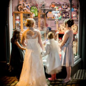 Glancing into the toy shop window at Kings Chapel Amersham wedding