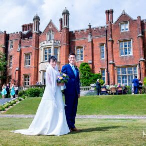 The newlyweds strolling along at their Latimer Estate wedding