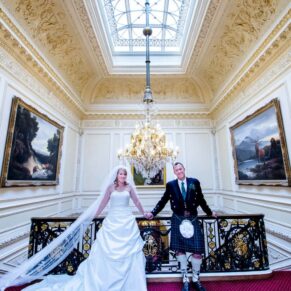 At the top of the staircase at Halton House wedding
