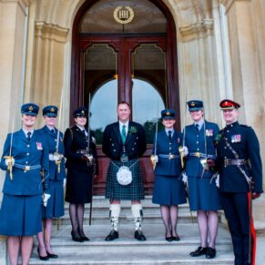 Group pose on the front steps at Halton House wedding