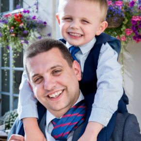 Fun father and son pose at Taplow House Hotel wedding