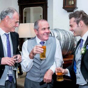 The lads chatting by the bar at Taplow House Hotel wedding