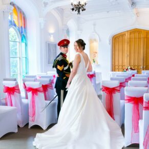The newlyweds in the Garden Room at their Missenden Abbey military wedding