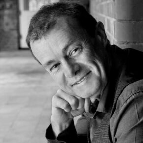 Commercial business portraits photography for small businesses in the Buckinghamshire and Berkshire areas and beyond - this photograph showcases one of my headshots of a company director in a relaxed pose outdoors