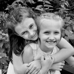 Time for a hug between these two young children during the drinks reception at Sopwell House