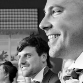 Guest reactions photography captured during the lively wedding speeches in the dining room at the Bay Tree Hotel in Burford